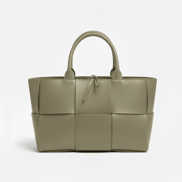 Front view of Aurelia green genuine leather tote bag with woven texture, leather handles, and tie closure