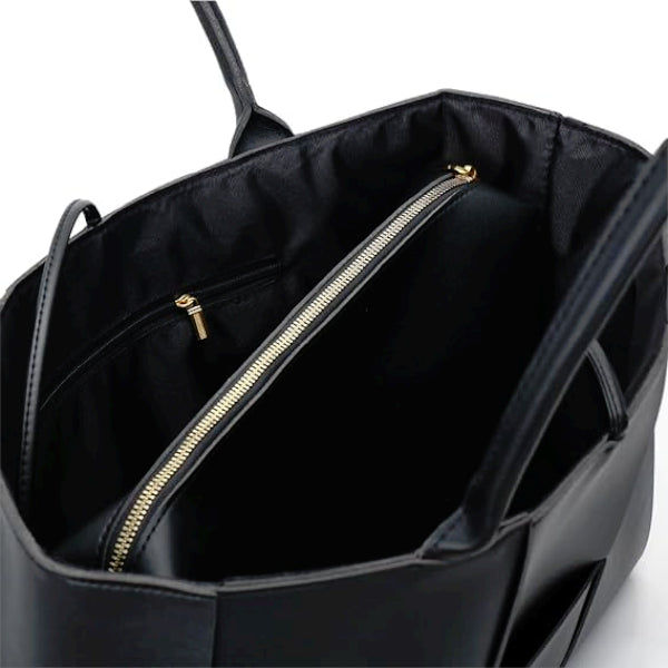Interior view of Aurelia black genuine leather tote bag with spacious black lining and a gold zipper pocket for organization