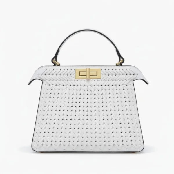 Front view of white woven vegan leather satchel bag with gold clasp, handle, and structured design