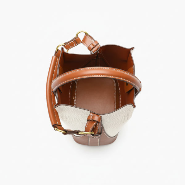 Calypso Vegan Leather Crossbody Bag in brown, top view of open interior with stitched lining, central strap, and gold hardware