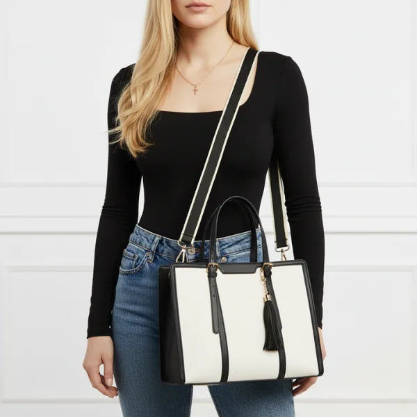 Clea duo set polyester tote bag model with black and white design featuring a tassel detail and adjustable shoulder strap