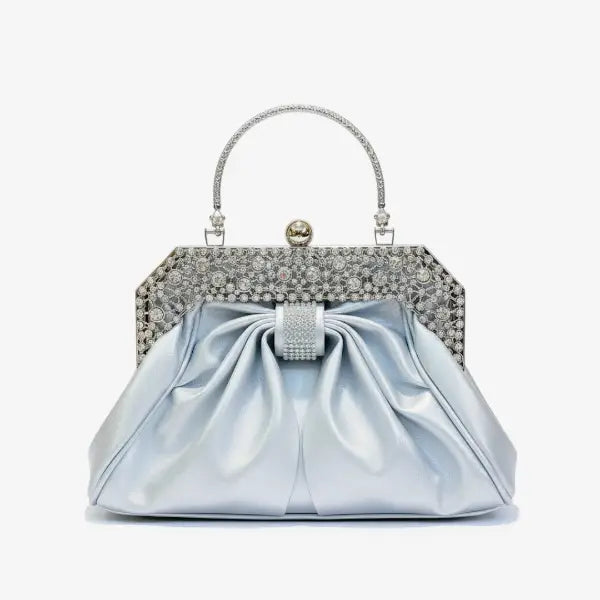Front view of a blue vegan leather evening bag featuring a rhinestone-studded gold frame, pleated design, and elegant clasp