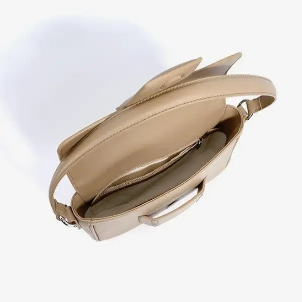 Inside view of the Faelina genuine cowhide shoulder bag in apricot showing its spacious interior with zipper pocket