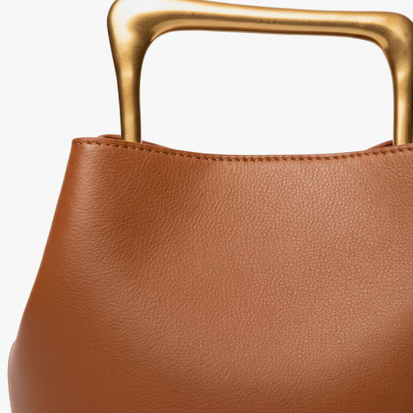 Izelia Genuine Leather Crossbody Bag in orange, closeup highlighting smooth leather and sculptural square gold metal handle