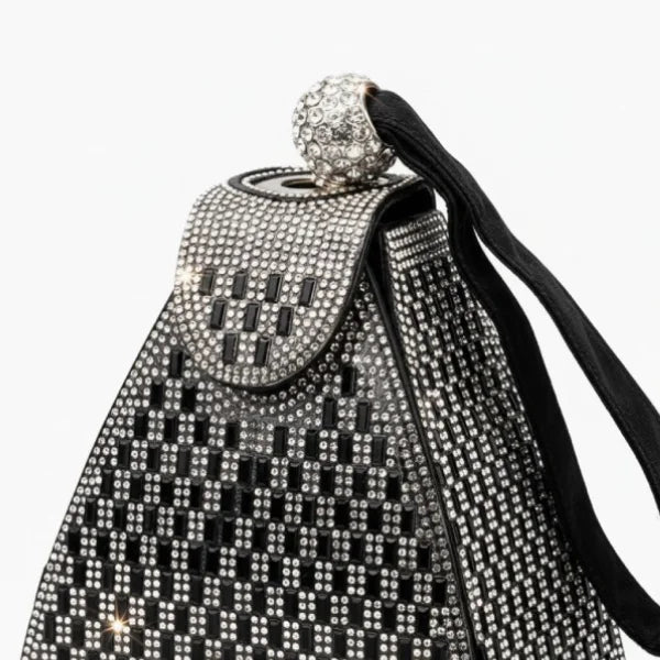 Liora Handmade Crystal Acrylic Evening Bag in black, closeup highlighting sparkling crystal pattern, beaded ball clasp, and wrist strap