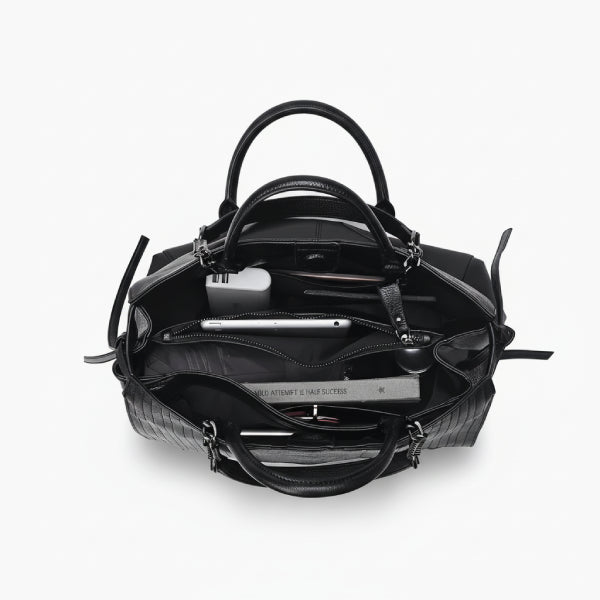 Interior view of black genuine leather tote bag, showcasing its spacious design with multiple compartments for easy organization