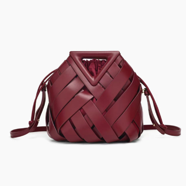 Seren Vegan Leather Bucket Bag in wine red, front studio view showing sculptural woven body with drawstring sides and triangle handle