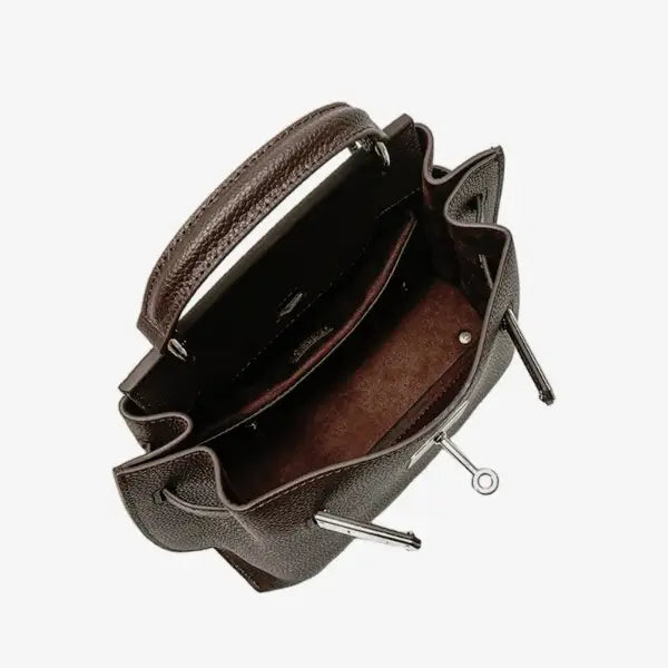 Interior view of the coffee brown genuine leather satchel bag, showcasing the spacious compartment and sleek lining