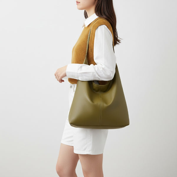 Sorella Vegan Leather Hobo Bag in green, lifestyle image with model wearing the shoulder hobo for modern everyday style