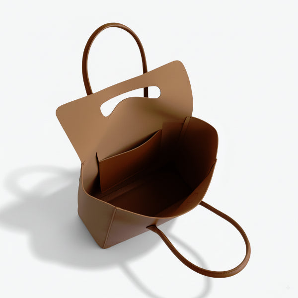 Interior view of the Sylvene vegan leather tote bag in caramel color, highlighting the spacious compartment and organizational features