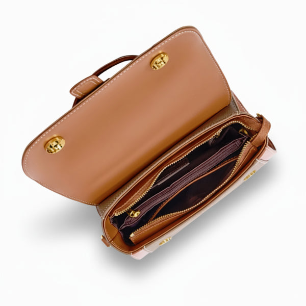 Interior view of the brown genuine leather satchel bag, showcasing multiple compartments with a rich brown lining and gold-tone hardware