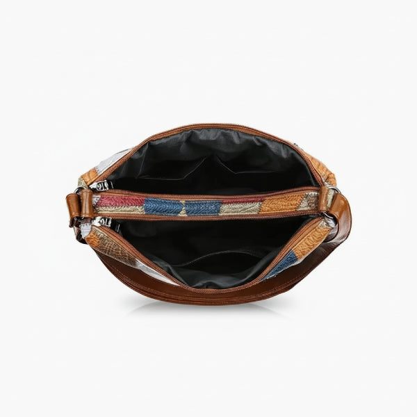 Vera Vegan Leather Crossbody Bag in brown, top view of spacious interior with center zip divider and multiple slip pockets
