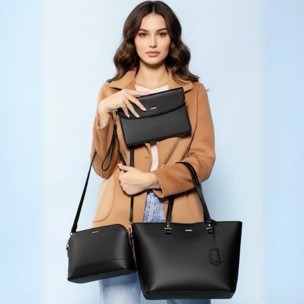 Model carrying the Vivienne vegan leather tote bag in black, paired with a beige coat, demonstrating its versatile and chic style