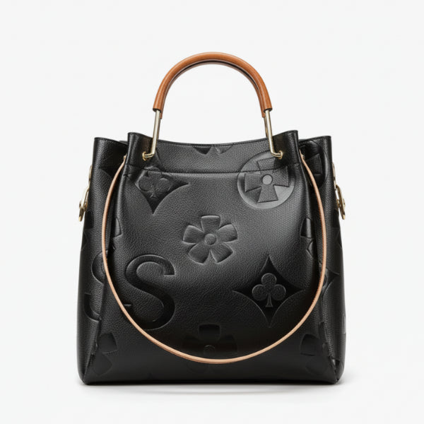 Front view of Amora embossed vegan leather tote bag in black with unique embossed design and handle details