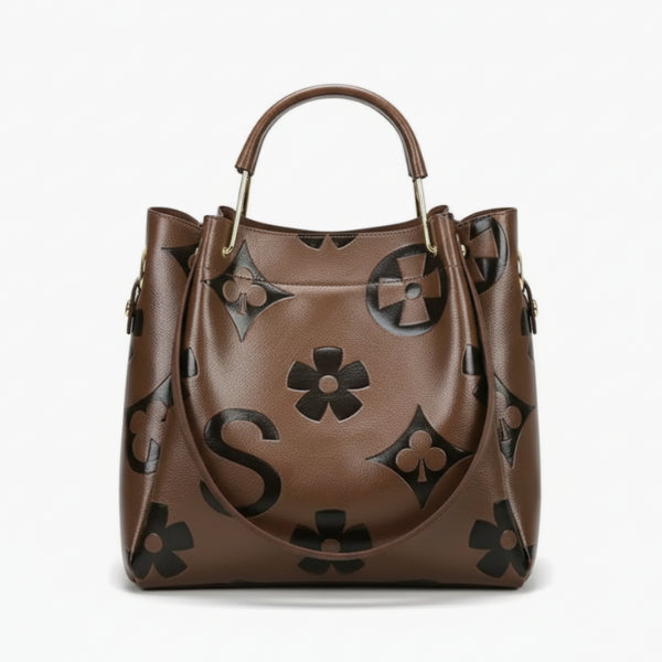 Front view of Amora embossed vegan leather tote bag in coffee color with floral and geometric embossed patterns