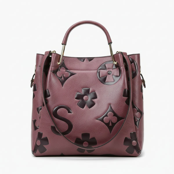 Front view of Amora embossed vegan leather tote bag in purple with floral and geometric embossed patterns