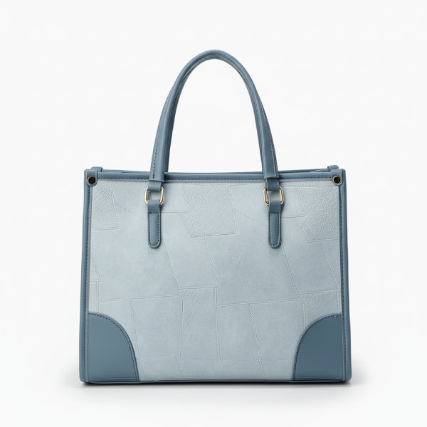 Front view of the Anelisse vegan leather tote bag in blue, with a modern geometric pattern and elegant detailing