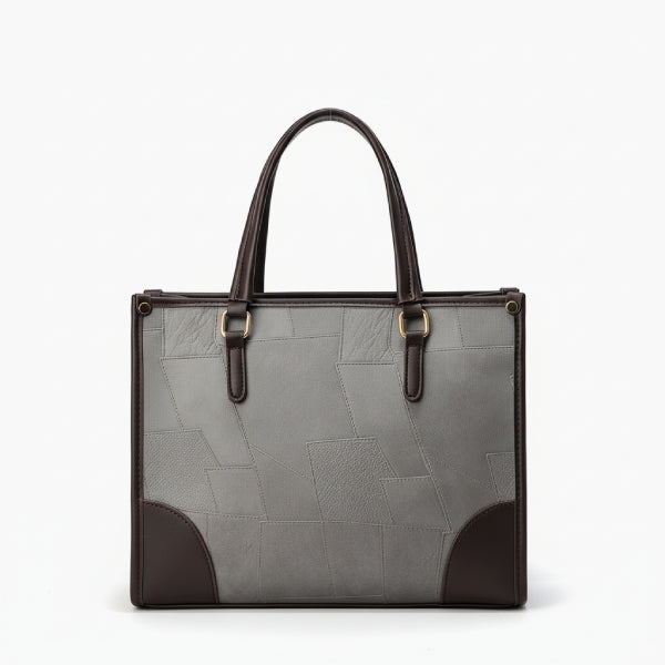 Front view of the Anelisse vegan leather tote bag in grey, with sleek design and elegant brown leather corners