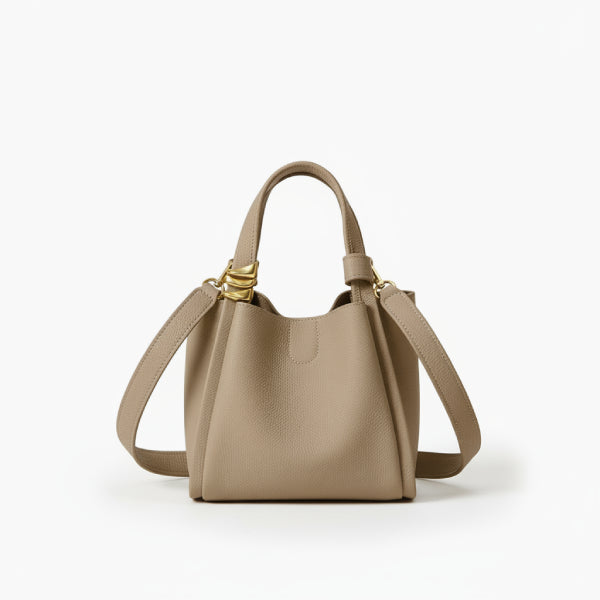Arden Genuine Leather Bucket Bag in beige, front studio view highlighting compact bucket silhouette, dual top handles, and crossbody strap