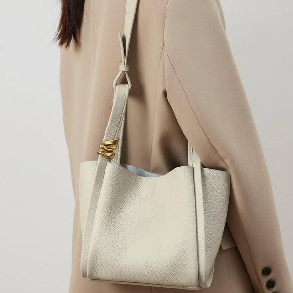 Arden Genuine Leather Bucket Bag in off-white, lifestyle shoulder shot on model showing size and elegant drape
