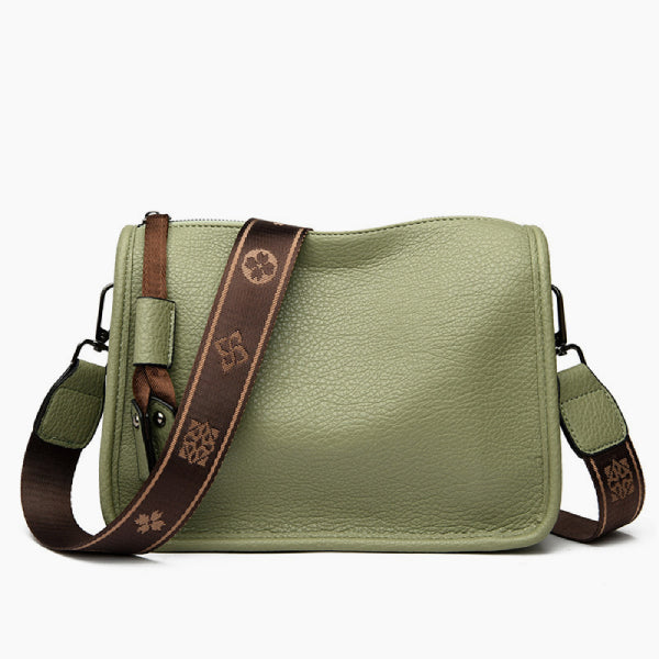 Auralis Genuine Cowhide Crossbody Bag in green, front studio view showcasing rectangular silhouette, zip-top closure, and adjustable patterned shoulder strap