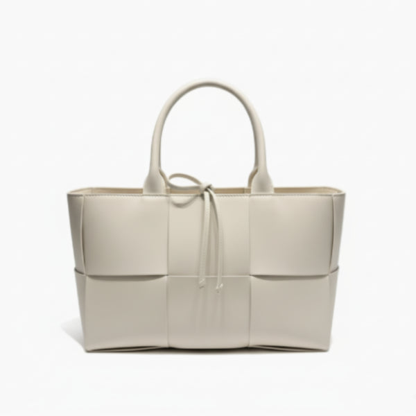 Front view of Aurelia off-white genuine leather tote bag with woven texture, leather handles, and tie closure
