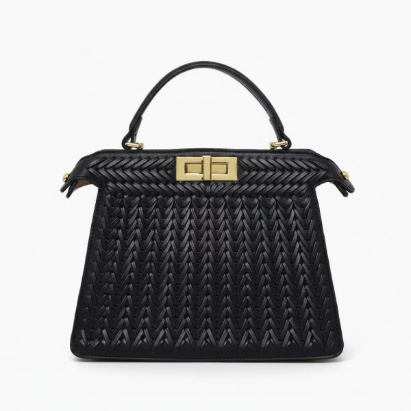 Front view of black woven vegan leather satchel bag with gold clasp and structured design
