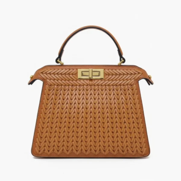 Front view of brown woven vegan leather satchel bag with gold clasp, handle, and structured design