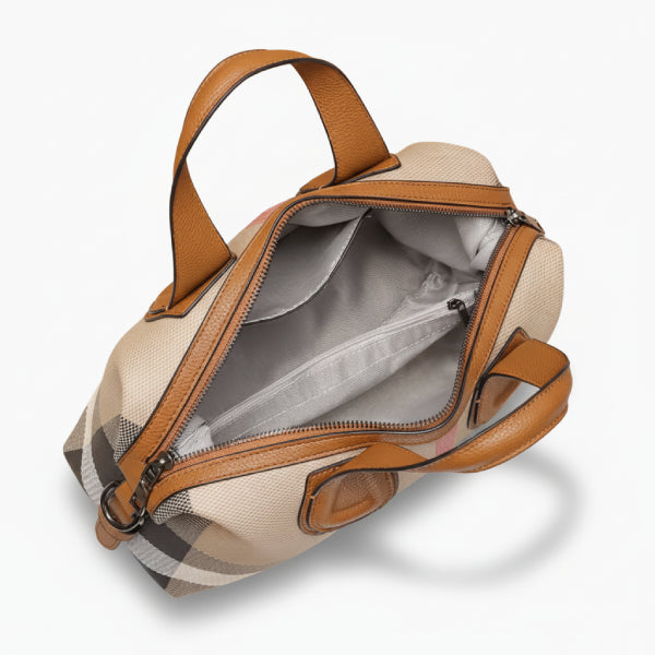 Interior shot of the brown vegan leather tote bag showing its spacious compartment and a zip pocket for organization