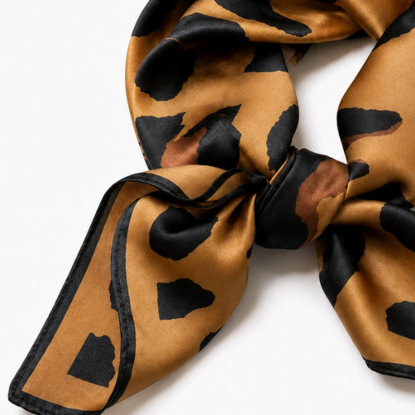 Leopard print scarf on a white background