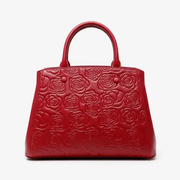 Front view of Azura genuine leather red satchel bag with rose embossed texture and gold hardware