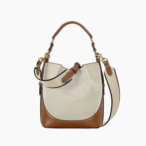 Calypso Vegan Leather Crossbody Bag in beige, front studio view showcasing structured bucket silhouette, top handle, and adjustable shoulder strap