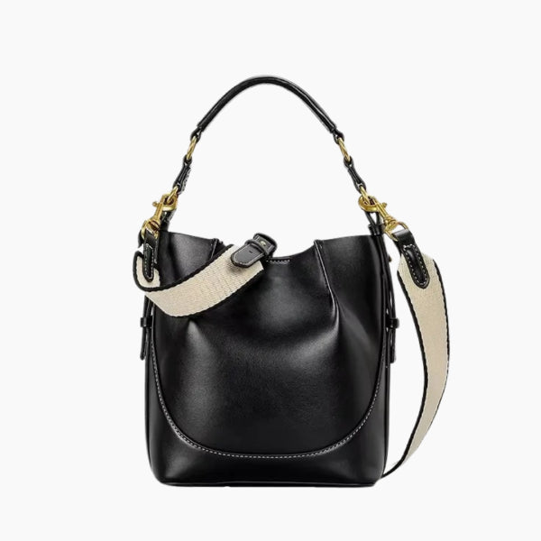 Calypso Vegan Leather Crossbody Bag in black, front studio view showcasing structured bucket silhouette, top handle, and detachable shoulder strap