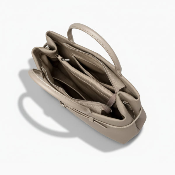 Interior shot of the khaki genuine leather tote bag showing multiple compartments for easy organization