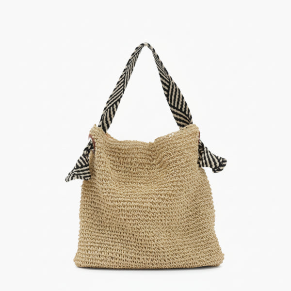Front view of beige woven tote bag with striped black and white handles, perfect for casual summer use
