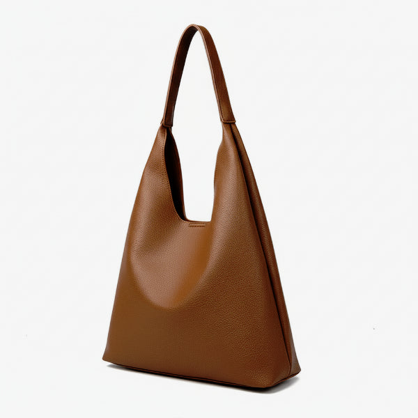 Front view of Elaria vegan leather hobo bag in brown, showcasing its minimalist design, spacious interior, and soft, slouchy silhouette