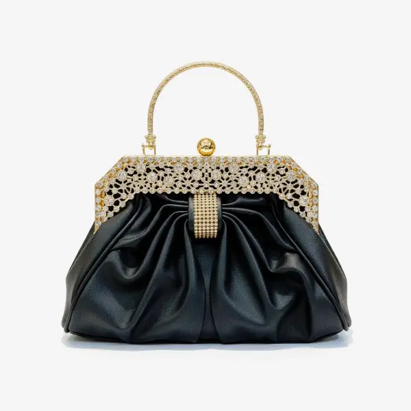 Front view of a black vegan leather evening bag with a rhinestone-studded gold frame and pleated design
