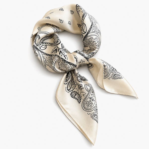 Necklace with a white bandana featuring black paisley patterns on a white background