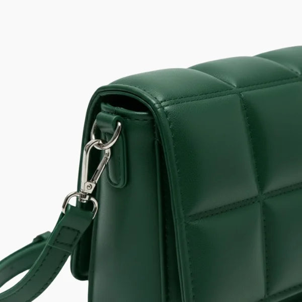 Isla Vegan Leather Crossbody Bag in green, closeup highlighting quilted square panels, silver hardware, and detachable strap clip