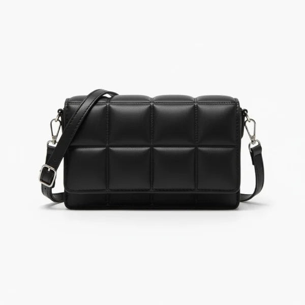 Isla Vegan Leather Crossbody Bag in black, front studio view showcasing quilted paneling with long adjustable strap