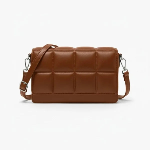 Isla Vegan Leather Crossbody Bag in brown, front studio view showcasing padded grid design and adjustable crossbody strap