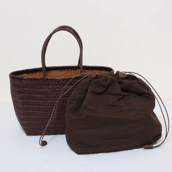 Interior view of a brown leather tote bag with a coffee cloth insert pouch