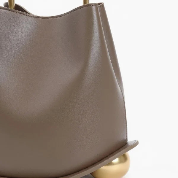 Izelia Genuine Leather Crossbody Bag in taupe, close-up with gold accents on a white background
