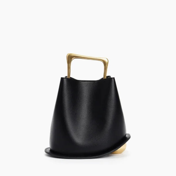 Front view of a Black Izelia top grain leather crossbody bag with a gold handle on a white background