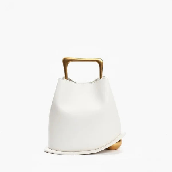 Front view of a White Izelia top grain leather crossbody bag with gold handle on a white background