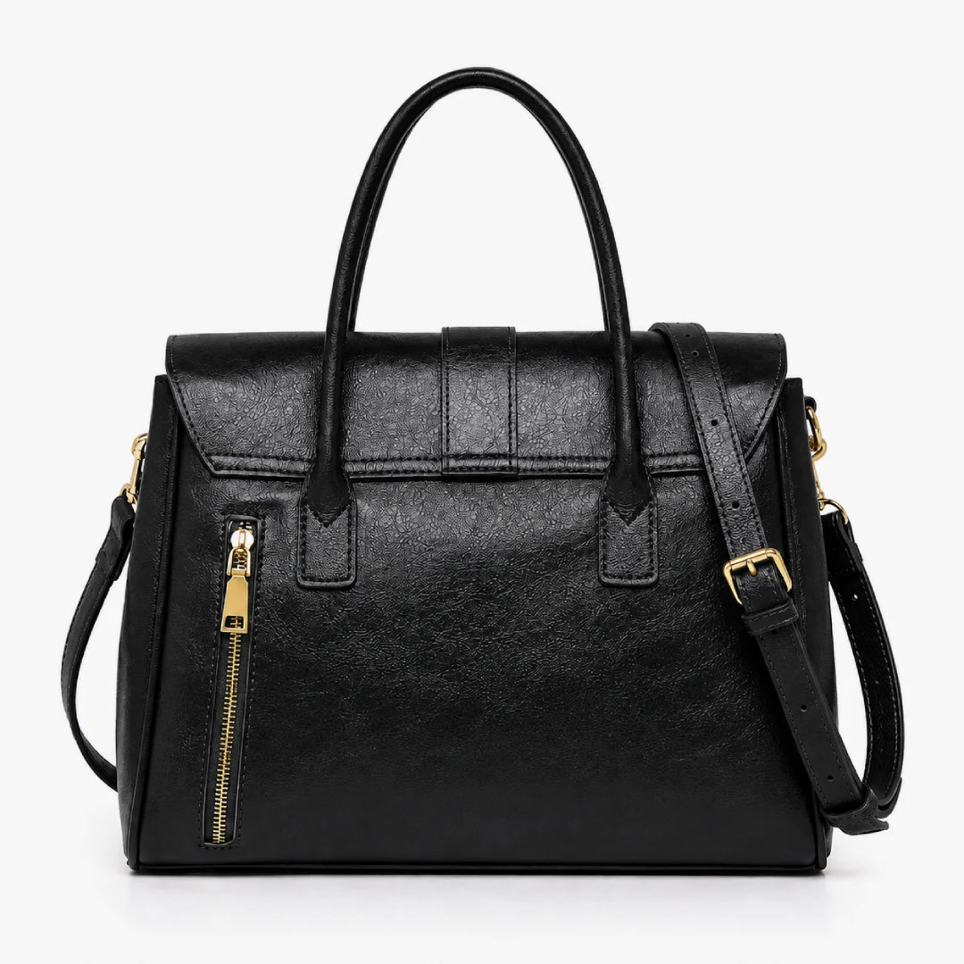 A black faux-leather handbag with dual top handles, a front zip pocket, and a detachable shoulder strap, shown on a plain white background.