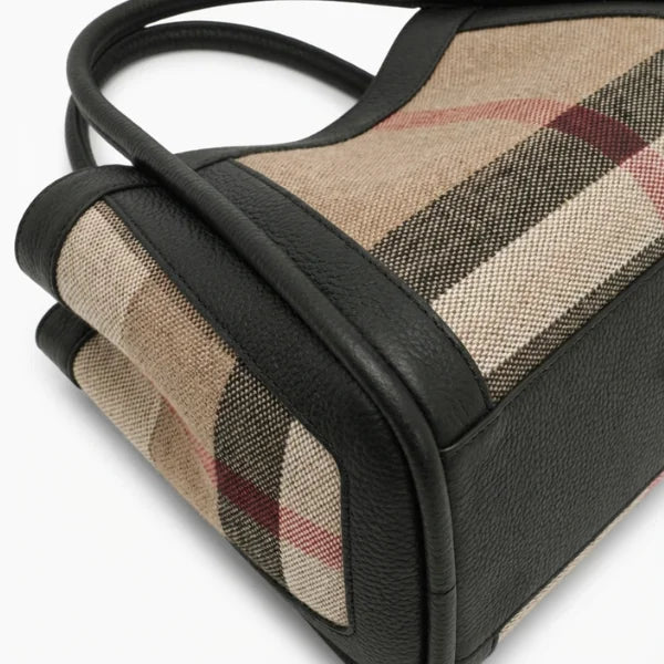 Plaid patterned bag with black accents on a white background