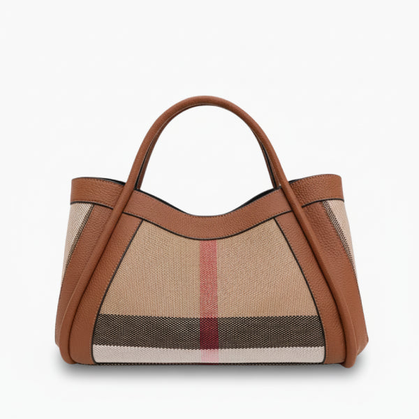 Front view of a brown canvas and leather tote bag with dual leather handles and a sleek design