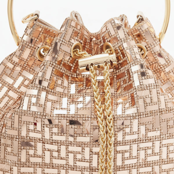Lyanna Metallic Embellished Bucket Bag in gold, closeup highlighting mosaic sequins, gold grommets, and chain drawstring tassels
