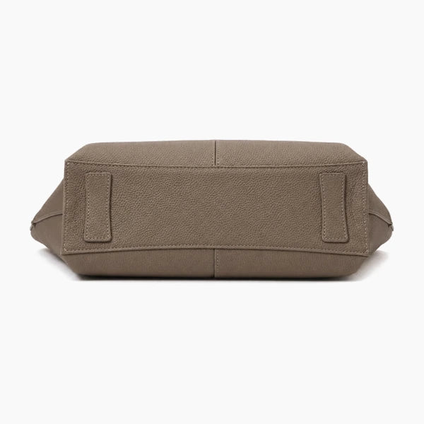 Montréa Genuine Leather Tote Bag in taupe, front view featuring two small rectangular leather tabs on the sides